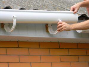 Hewatt technician installing new gutters